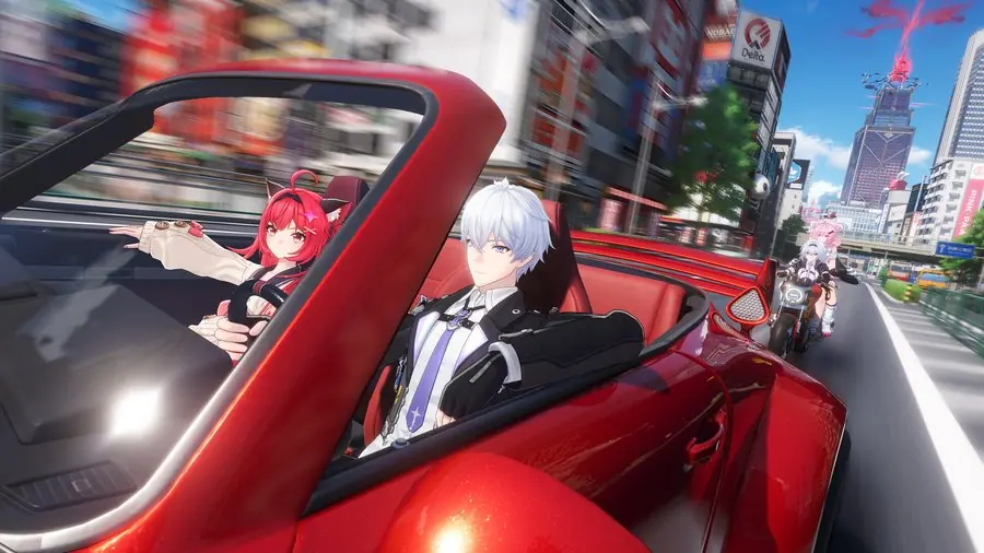 A red convertible speeds down a city street with a passenger companion and a motorcycle following behind